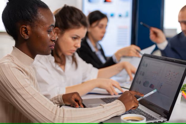 cheerful-african-business-lady-typing-laptop-smiling-sitting-desk-busy-start-up-office_482257-5075.jpg