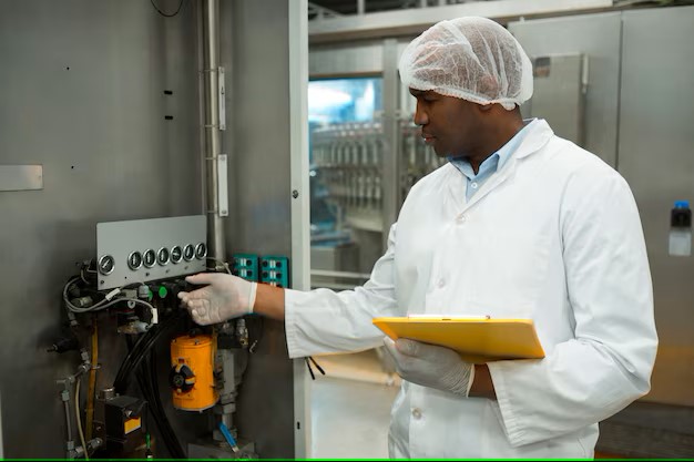 confident-worker-operating-machine-juice-factory_107420-96520.jpg